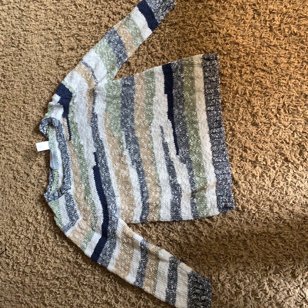 selling a light green white and dark blue sweater!